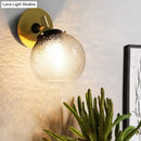 GobekUsa Minimalist 1-Light Gold Wall Sconce: Exposed Ball Design for Living Room, Water Glass Feature