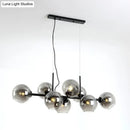 GobekUsa Minimalist Clear/Smoke Grey Glass Globe Island Chandelier - 8 Lights Black/Gold Dining Room Lighting