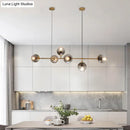 GobekUsa Minimalist Brass Ball Island Lamp: 6-Bulb Suspension Light with Glass Shade - Perfect for Restaurants