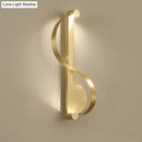 GobekUsa Minimalistic Brass Curve LED Wall Mount Light: Stylish Metal Sconce for Living Room