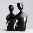 Minimalist bronze & black resin couple sculptures bedroom decor by Decorbites