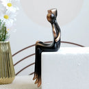 Minimalist bronze & black resin couple sculptures bedroom decor by Decorbites