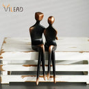 Minimalist bronze & black resin couple sculptures bedroom decor by Decorbites