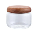 Minimalist clear glass kitchen storage jar with acacia wood lid by Decorbites