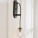 GobekUsa Minimalist Clear Glass Wall Sconce with 1 Light - Black Wall Mounted Fixture