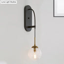 GobekUsa Minimalist Clear Glass Wall Sconce with 1 Light - Black Wall Mounted Fixture