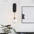 GobekUsa Minimalist Clear Glass Wall Sconce with 1 Light - Black Wall Mounted Fixture