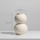 Minimalist cream ceramic art vase living room sculptural decor by Decorbites