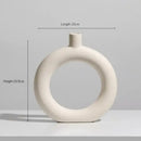 Minimalist cream ceramic art vase living room sculptural decor by Decorbites