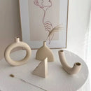 Minimalist cream ceramic art vase living room sculptural decor by Decorbites