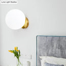 GobekUsa Minimalist Bedside Sconce Light with White Glass Ball and Gold Wall Mount