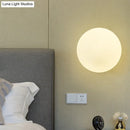 GobekUsa Minimalist Bedside Sconce Light with White Glass Ball and Gold Wall Mount