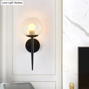 GobekUsa Clear Glass Mini Sphere Wall Lamp - Minimalist Living Room Sconce with Pencil Arm in Black/Gold