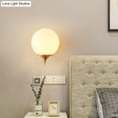 GobekUsa Minimalist Gold Sphere Bedside Wall Sconce - 1-Light Milk Glass Wall Mounted Light with Right Angle Arm