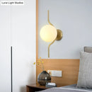 GobekUsa Globe White Glass Wall Mount Sconce Light with Elegant Gold Arm and Base