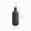Minimalist matte pastel geometric ceramic vase living room decor by Decorbites