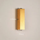 Minimalist natural wood angled wall lamp for bedroom decor by Decorbites