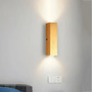 Minimalist natural wood angled wall lamp for bedroom decor by Decorbites