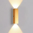 Minimalist natural wood angled wall lamp for bedroom decor by Decorbites