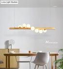 GobekUsa Minimalist Wooden Island Pendant with Glass Sphere for Living Room Ceiling Lighting