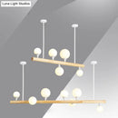 GobekUsa Minimalist Wood Island Pendant Light with Opal Glass Balls - perfect for Restaurants