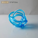 Modern amber & clear glass knot twist sculpture living room decor by Decorbites