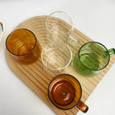Modern amber glass coffee mug with black rim for kitchen dining room by Decorbites