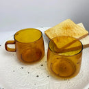 Modern amber glass coffee mug with black rim for kitchen dining room by Decorbites
