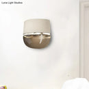 GobekUsa Modern Arched Wall Sconce in White with Grid Pattern Fabric and Tan Glass Bottom