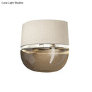 GobekUsa Modern Arched Wall Sconce in White with Grid Pattern Fabric and Tan Glass Bottom