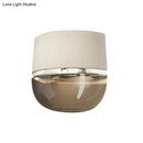 GobekUsa Modern Arched Wall Sconce in White with Grid Pattern Fabric and Tan Glass Bottom