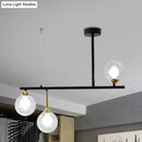 GobekUsa Modern Clear Glass Pendant Light Fixture: 3-Bulb Globe Island Lighting in Black for Dining Room