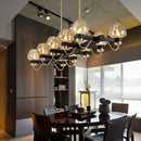 GobekUsa Contemporary Island Lamp: 10 Glass Bulbs in Clear/Amber/Smoke Suspended Fixture - Black/Brass for Bedroom