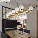 GobekUsa Contemporary Island Lamp: 10 Glass Bulbs in Clear/Amber/Smoke Suspended Fixture - Black/Brass for Bedroom