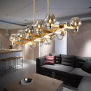 GobekUsa Contemporary Island Lamp: 10 Glass Bulbs in Clear/Amber/Smoke Suspended Fixture - Black/Brass for Bedroom
