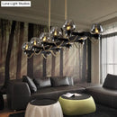 GobekUsa Contemporary Island Lamp: 10 Glass Bulbs in Clear/Amber/Smoke Suspended Fixture - Black/Brass for Bedroom