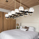 GobekUsa Contemporary Island Lamp: 10 Glass Bulbs in Clear/Amber/Smoke Suspended Fixture - Black/Brass for Bedroom