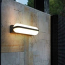 GobekUsa Modern Black Acrylic Wall Sconce with Flush Capsule Design and Half-Bulb Mounting