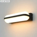 GobekUsa Modern Black Acrylic Wall Sconce with Flush Capsule Design and Half-Bulb Mounting