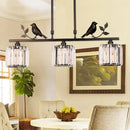 GobekUsa Modern Black/Gold Chandelier Lamp with Clear Crystal Drum Shade, Bird Accent - 3 Heads Hanging Light Fixture