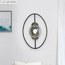 GobekUsa Modern Clear Glass Orb Sconce Lamp - 1-Bulb Black/Gold Wall Light with Ring Detail