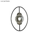 GobekUsa Modern Clear Glass Orb Sconce Lamp - 1-Bulb Black/Gold Wall Light with Ring Detail
