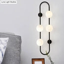 GobekUsa Modern Matte White Glass Globe Wall Sconce with 4-Light Bedroom Lighting Ideas in Black/Gold