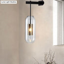 GobekUsa Modern Wall Mounted Clear Glass Cylinder Sconce Light Fixture - 1 Light, Black/Gold