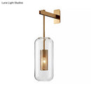 GobekUsa Modern Wall Mounted Clear Glass Cylinder Sconce Light Fixture - 1 Light, Black/Gold