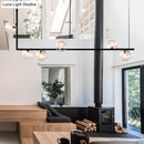GobekUsa Modern Minimalism Black Linear 6-Light Island Pendant Lighting with Sphere Glass Shade for Living Room.