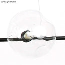 GobekUsa Modern Black Metal Chandelier with Glass Bubble Shade – 6-Light Restaurant Hanging Pendant for Stylish Ambiance