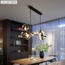 GobekUsa Modern 5-Light Black Metal Pendant Lighting with Spherical Glass for Dining Table