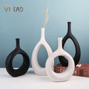 Modern black & white ceramic vase set living room decor by Decorbites
