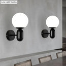 GobekUsa Modern White Wall Lamp with Globe Shade, Capsule Body - Metal & Glass Wall Light for Meeting Room
